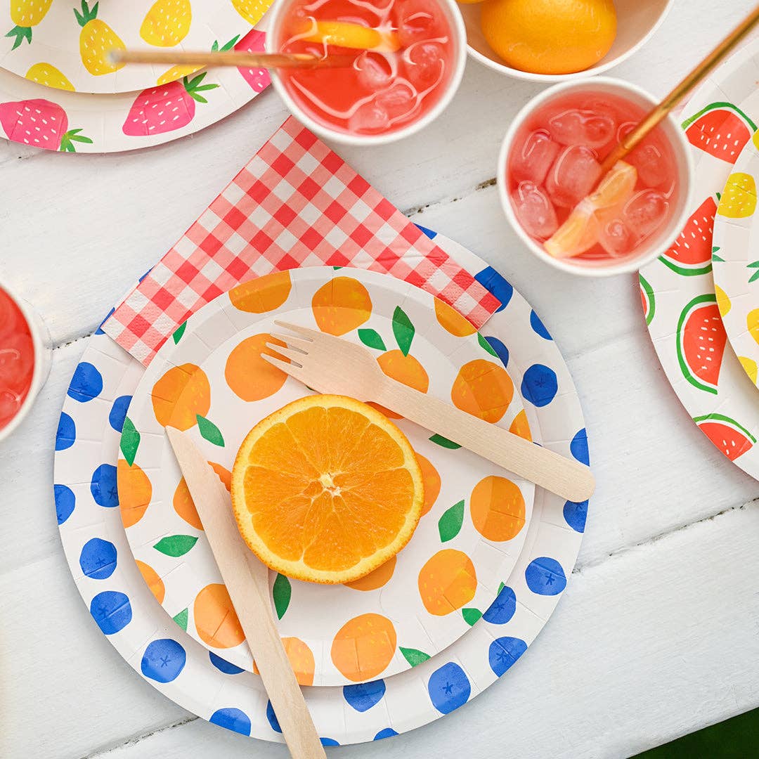 Paper party plates featuring strawberries, blueberries, pineapples, watermelon and oranges