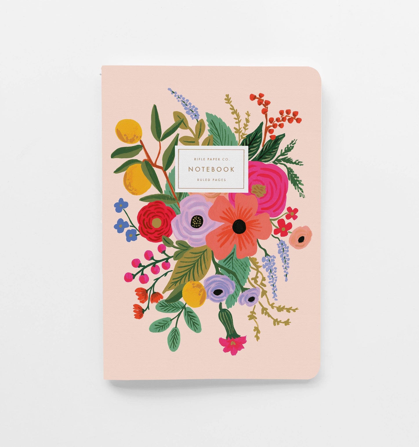 Light pink notebook with floral design on a white background