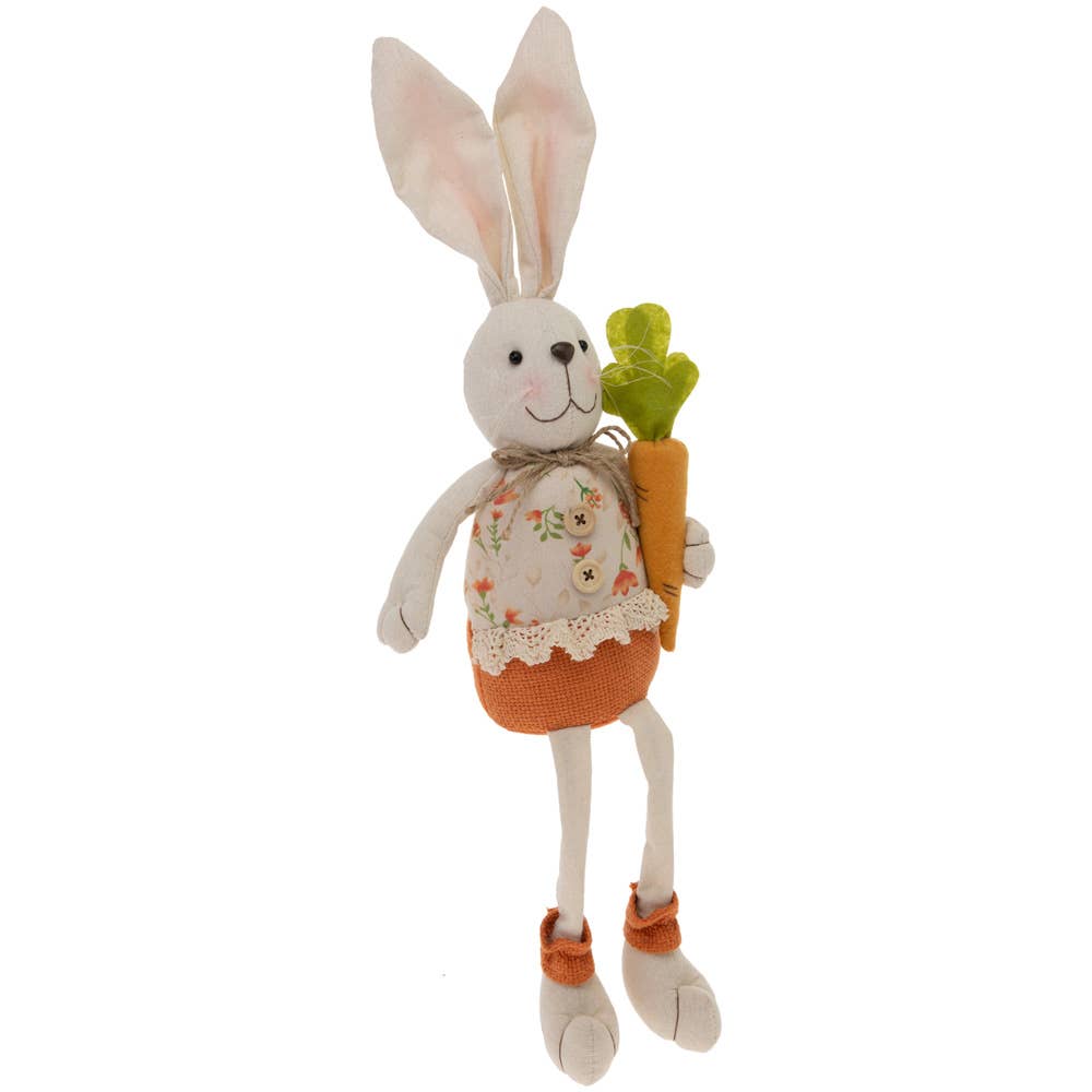 decorative stuffed bunny with long legs, tall ears and holding a carrot