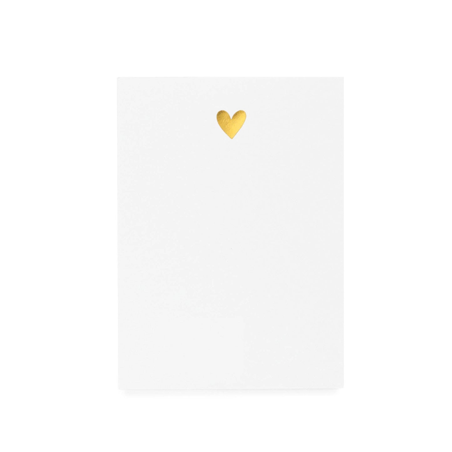 White notepad with a gold heart detail on the top