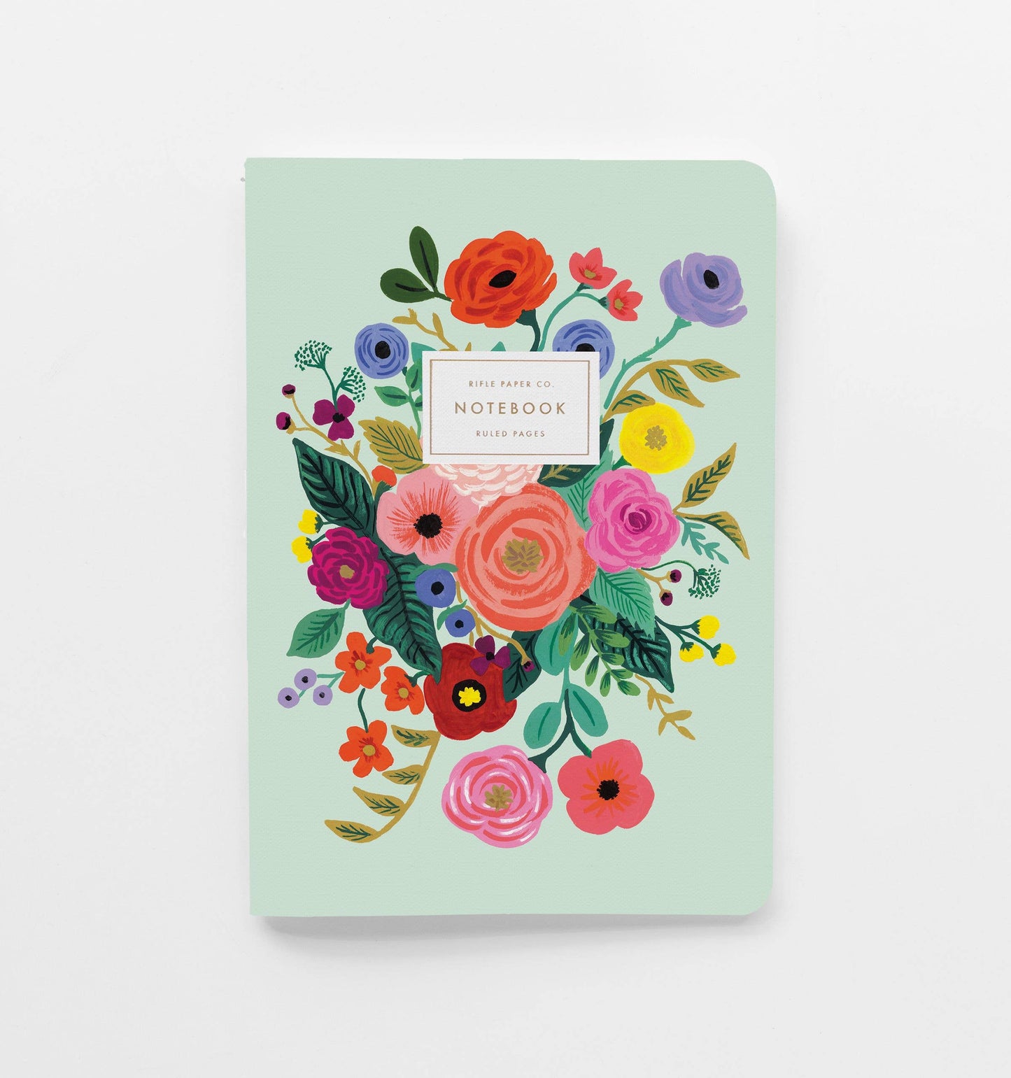 Teal notebook with floral design on a white background