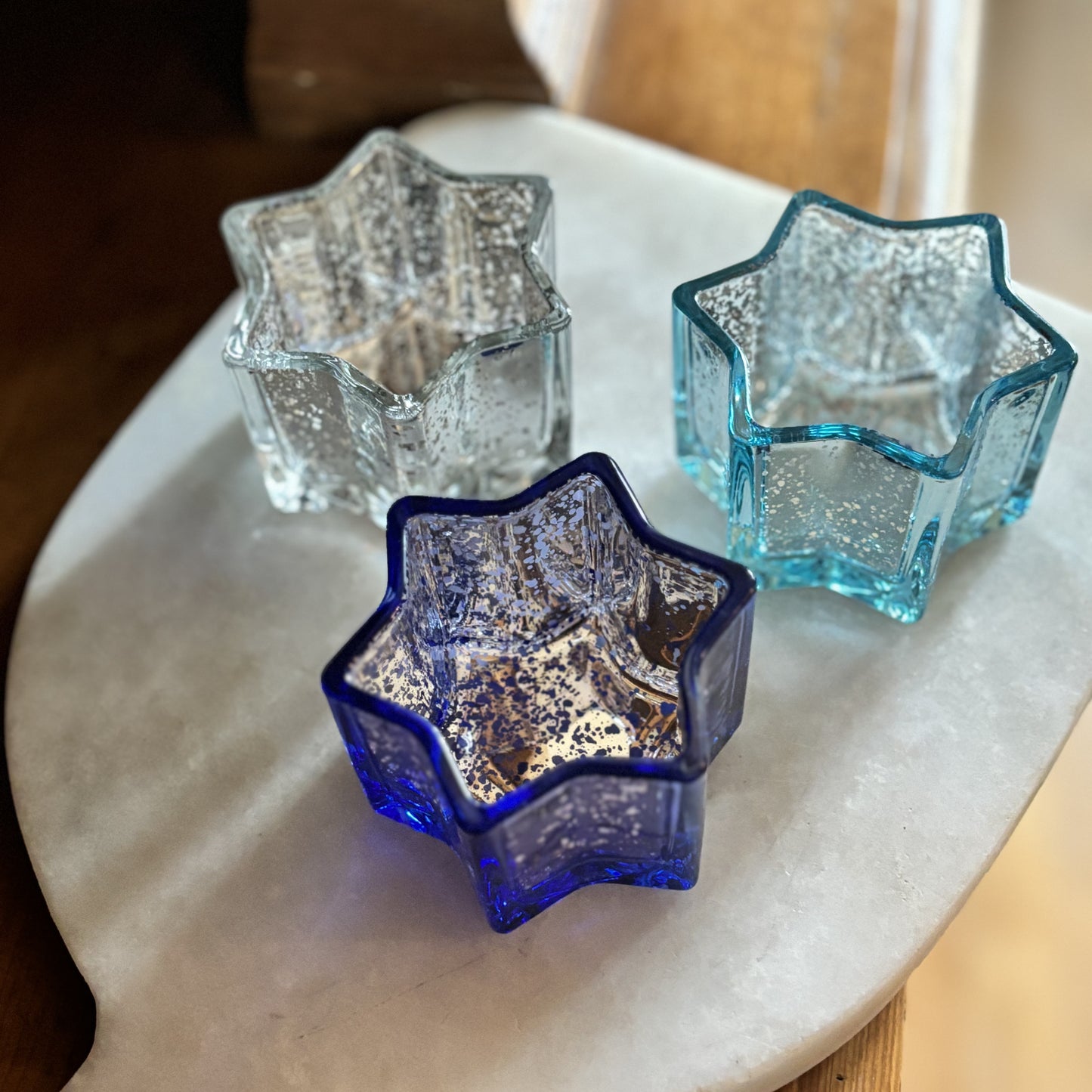 lifestyle photo of star shaped votive candle holders
