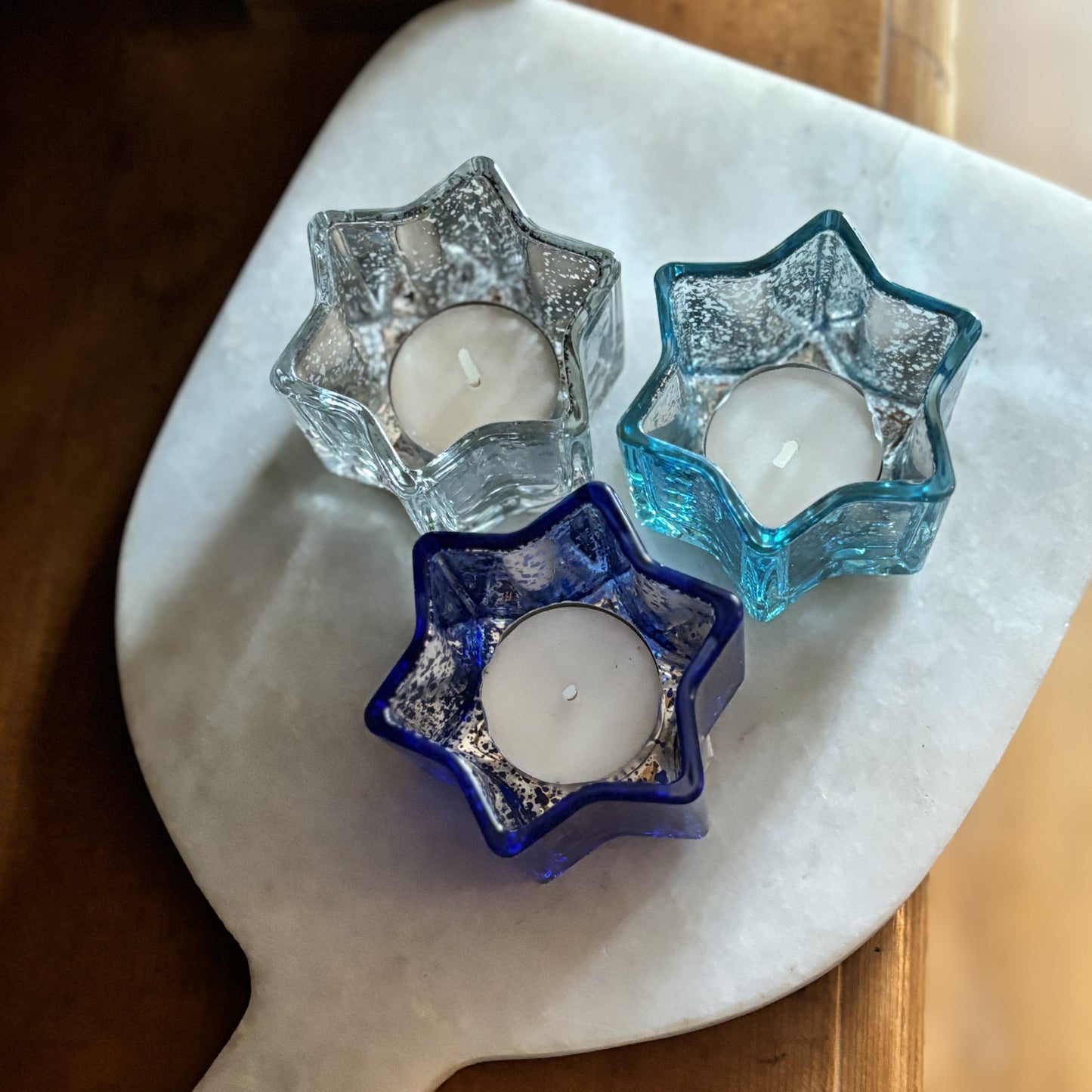 lifestyle photo of star shaped votive candle holders