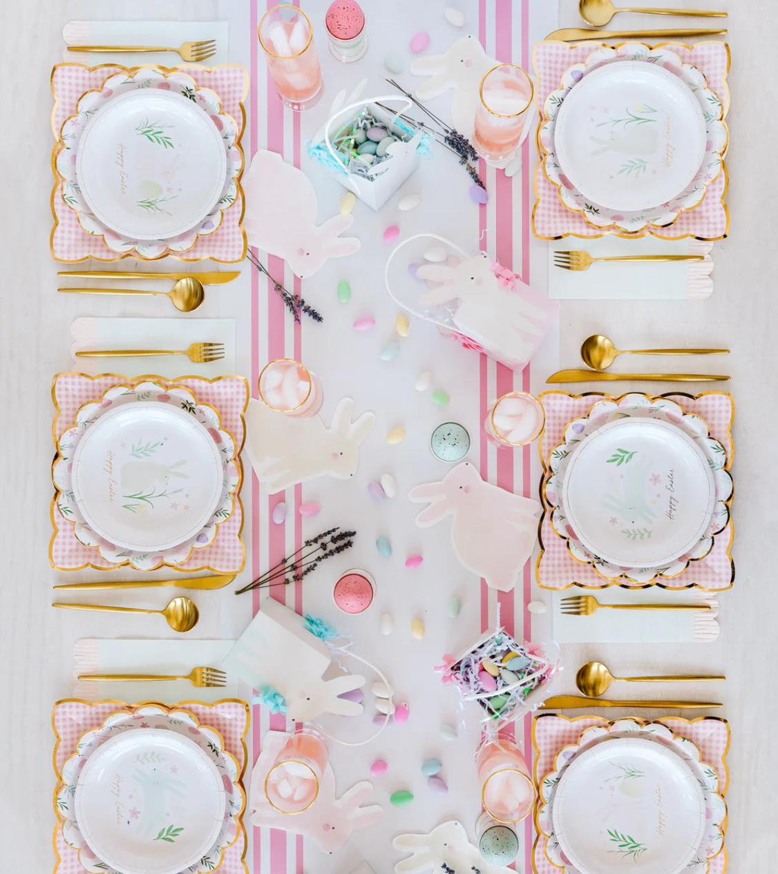 Image of a pink-and-white striped table runner on a decorated Easter table.