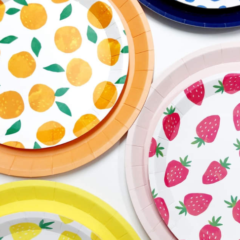 Paper party plates featuring strawberries, blueberries, pineapples, watermelon and oranges