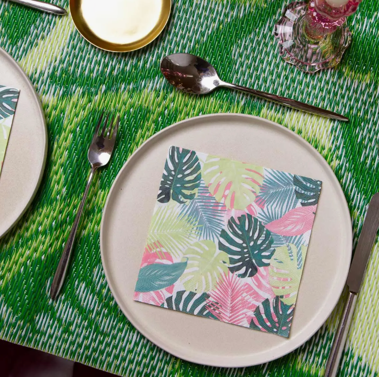 Product shot of colorful palm leaf napkins on a decorated table