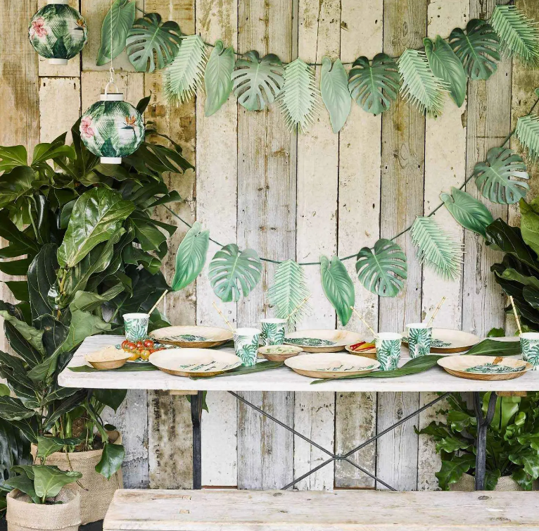 Image of green leaf paper cups in situation at a themed party