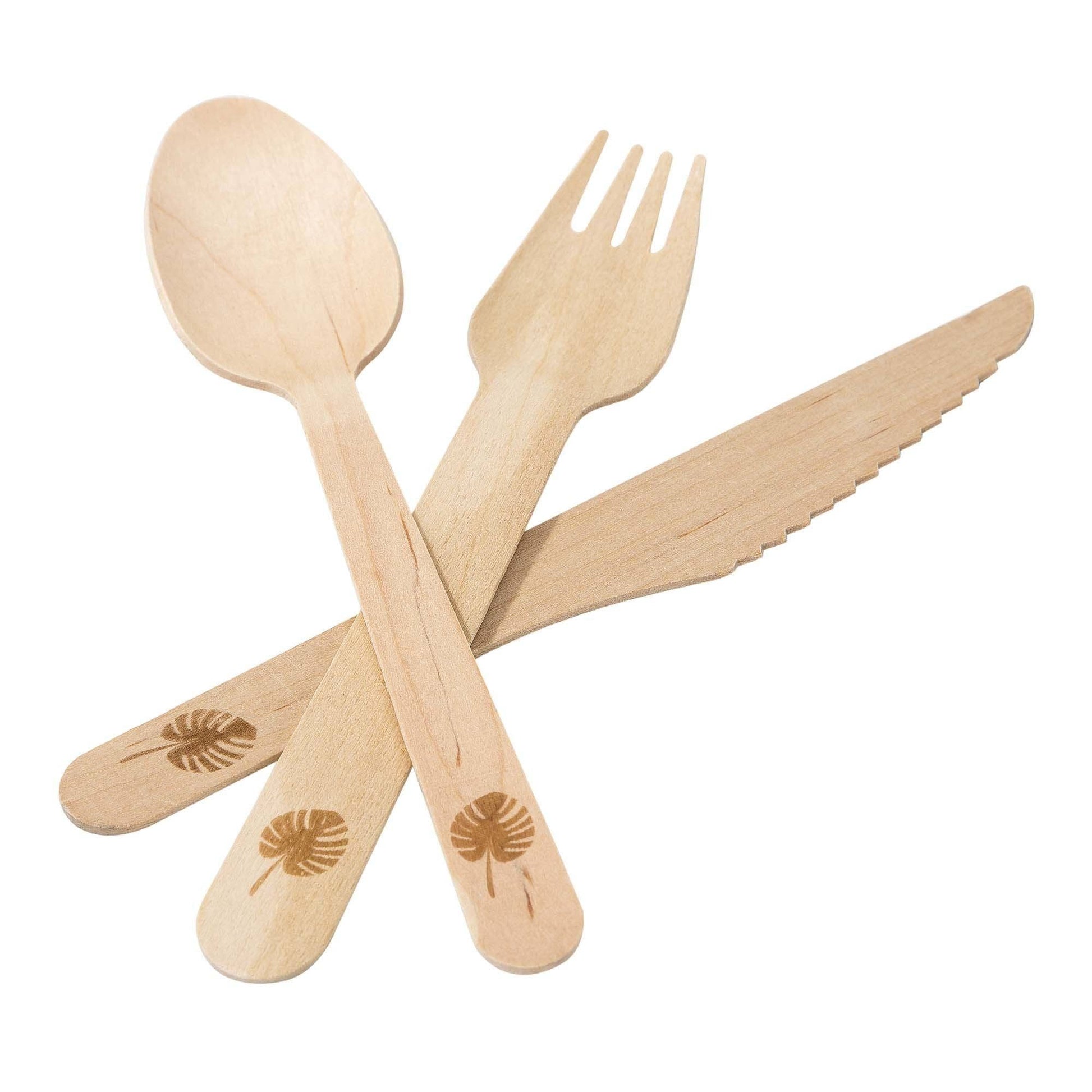 Set of wooden cutlery with etched leaf design on a white background