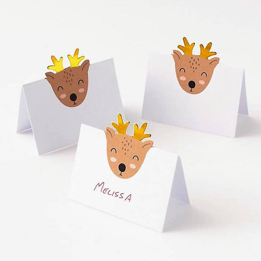 Three small reindeer place cards cards on a white background
