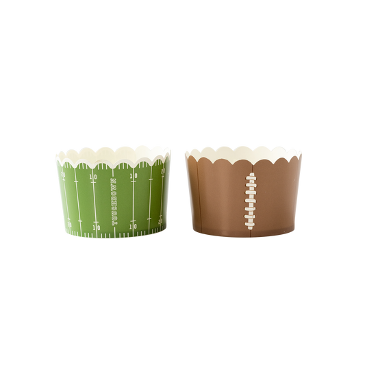Two cupcake liners, one green with football field design and one brown with football design, on a white background.