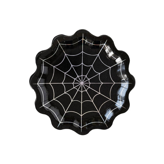 Black spider web paper plate on a white background