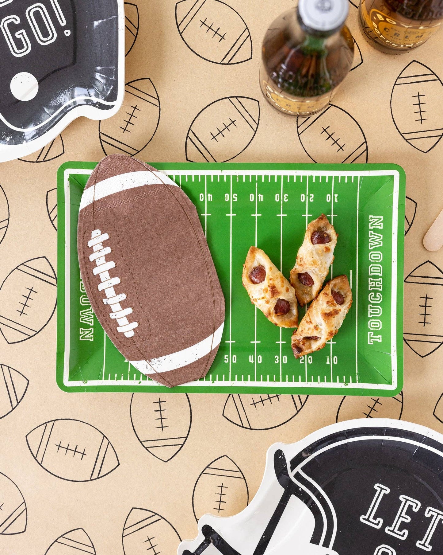 Football party lay down with napkins, plates and snacks