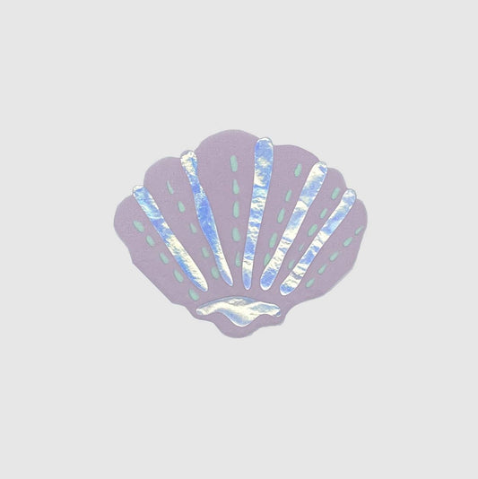 Iridescent shell napkin on a light gray background