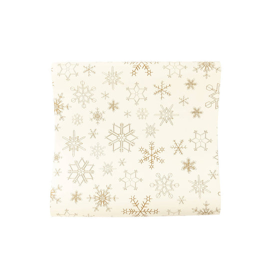 Gold snowflake table runner on a white background