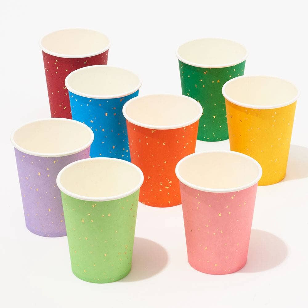 Set of colorful paper cups with white interiors on a white background