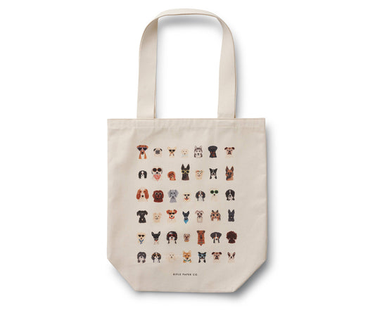 Beige tote bag with dog illustrations on a white background