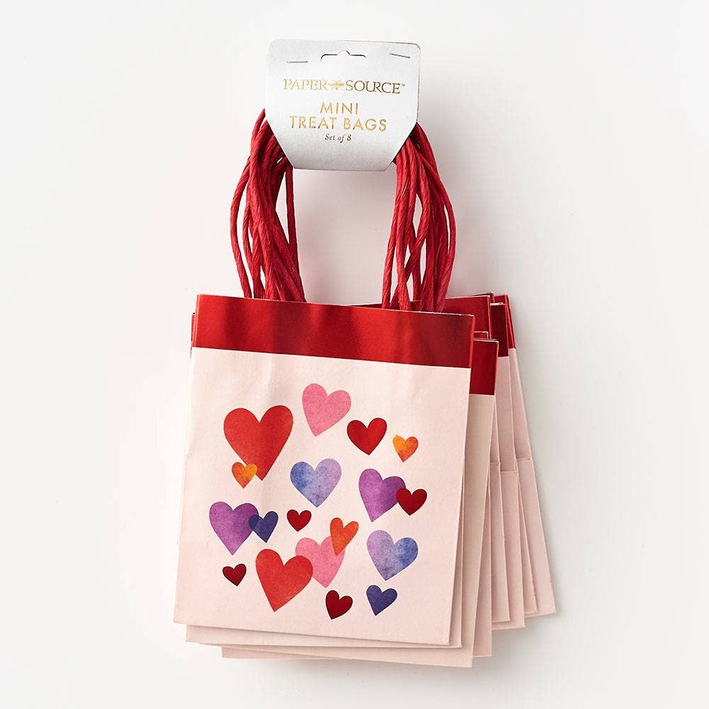 Set of mini treat bags with heart designs on a white background