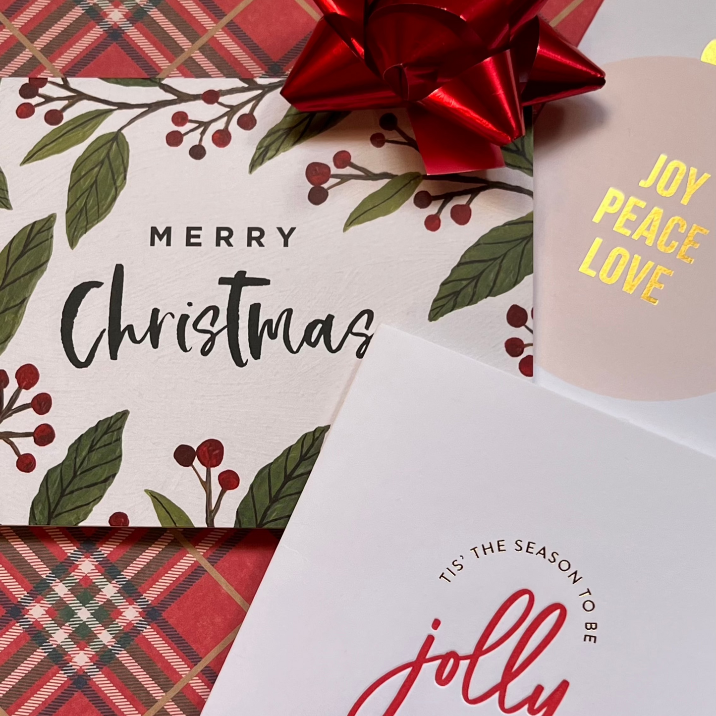 Image of 3 Christmas greeting cards on a plaid background