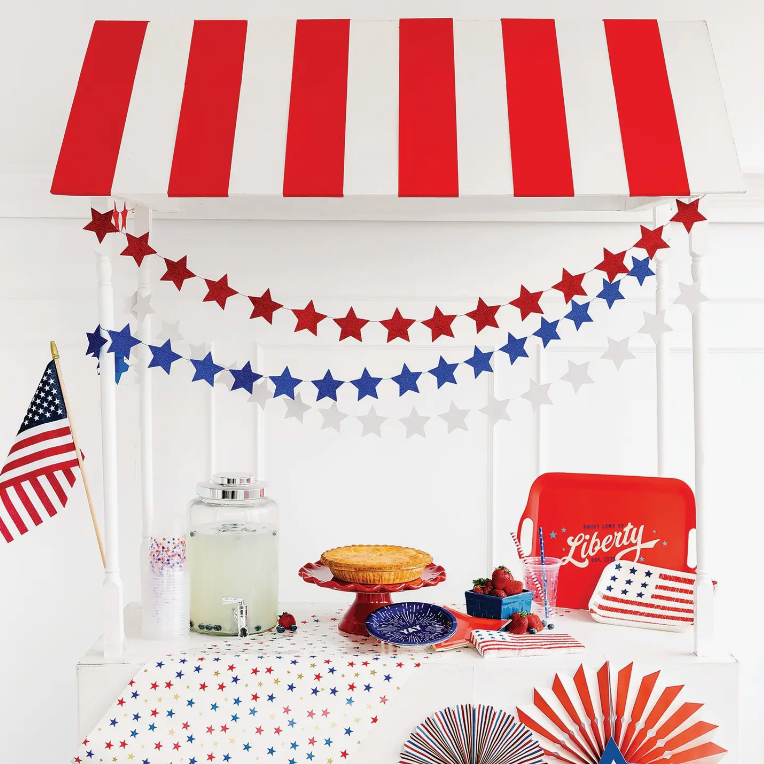 Lifestyle image showcasing the mini star glitter banner amongst other July 4th decor