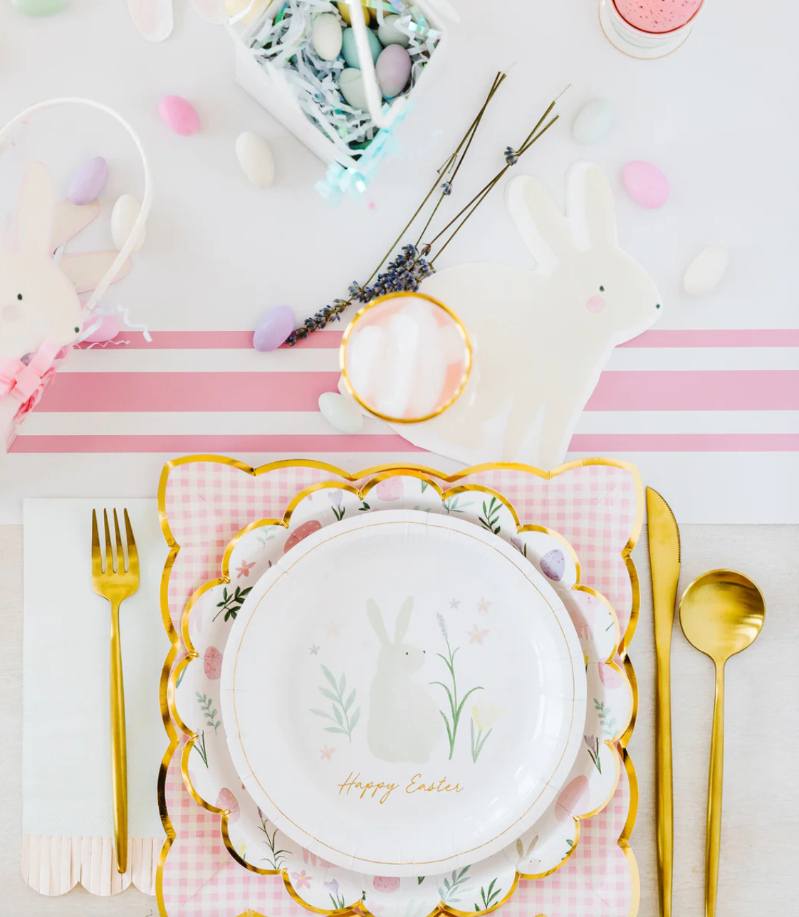 Image of a pink-and-white striped table runner on a decorated Easter table.