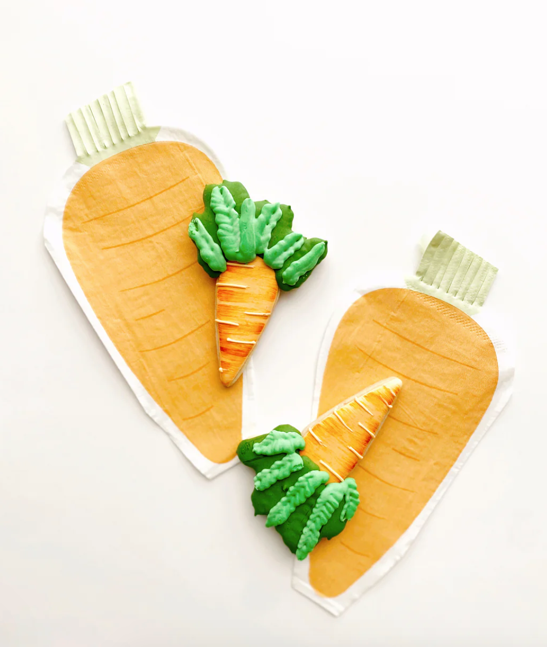 Front image of a carrot-shaped paper napkin on a decorative Easter table.