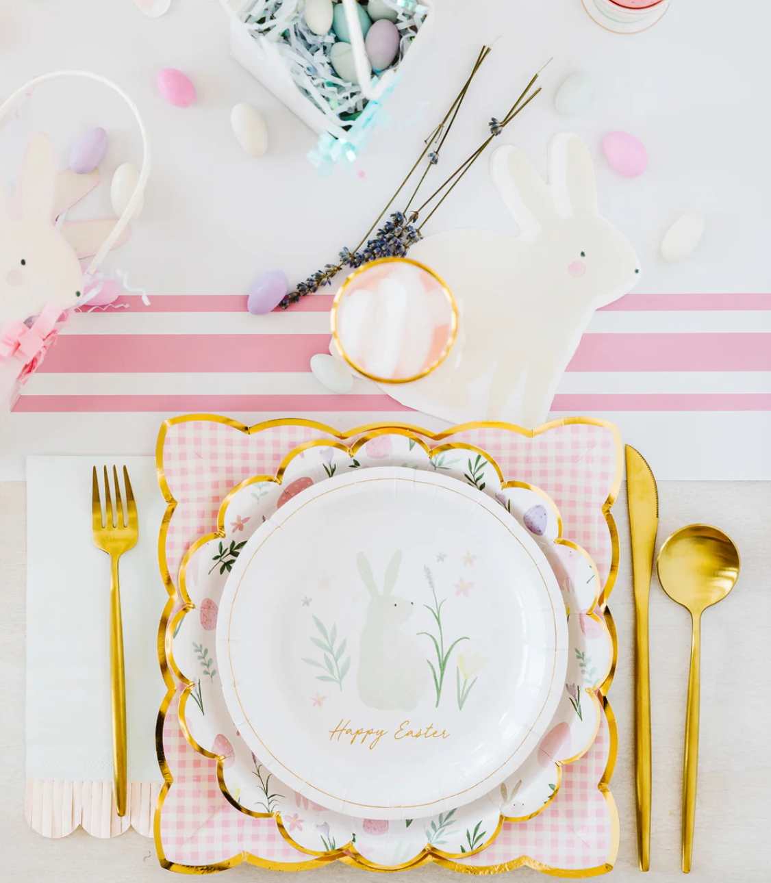 Pink gingham plates on a decorative Easter table.