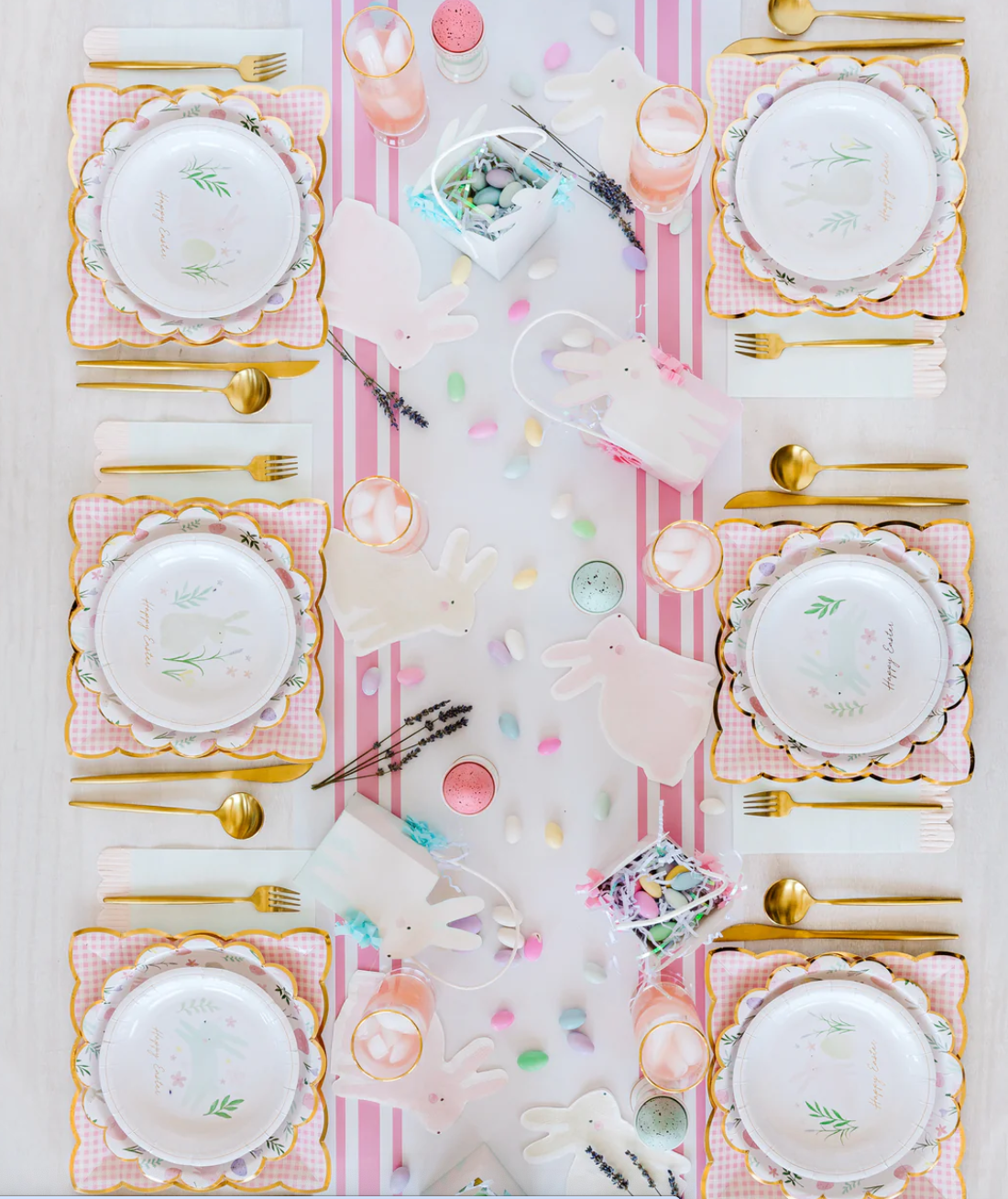 Pink gingham plates on a decorative Easter table.