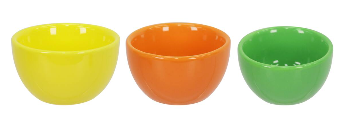 trio of ceramic bowls in yellow, orange and green