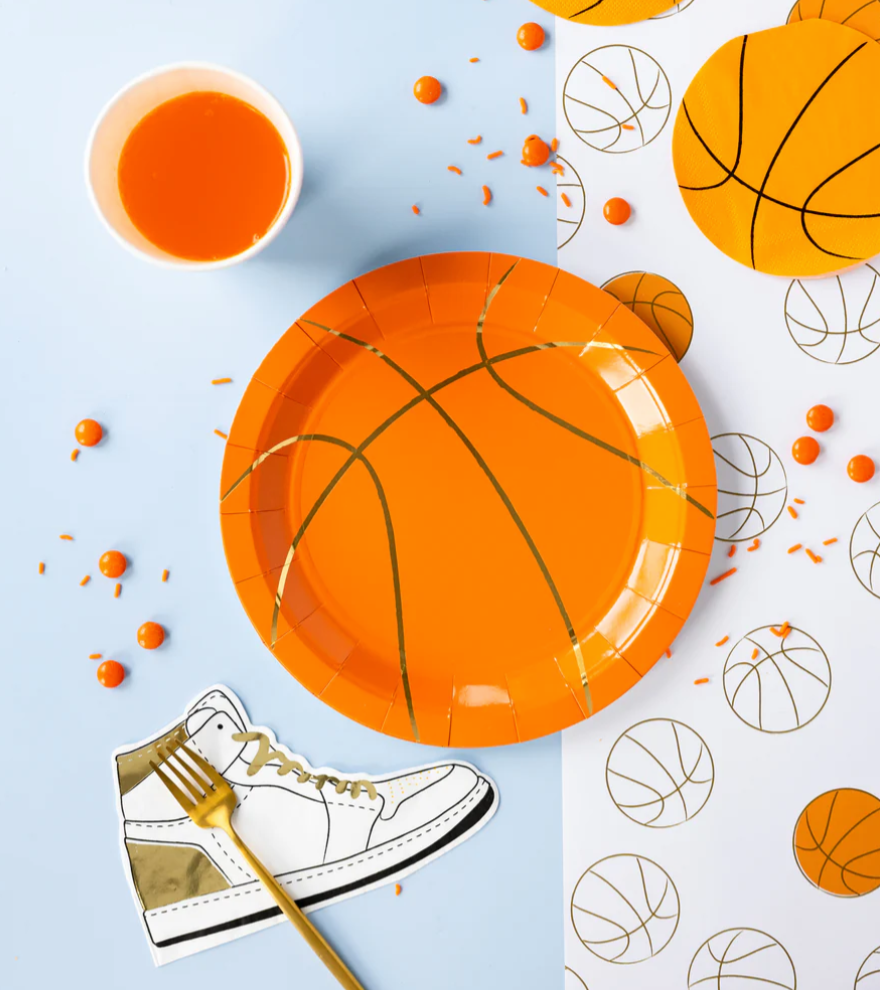 Image of a die-cut basketball napkin on a party table laydown