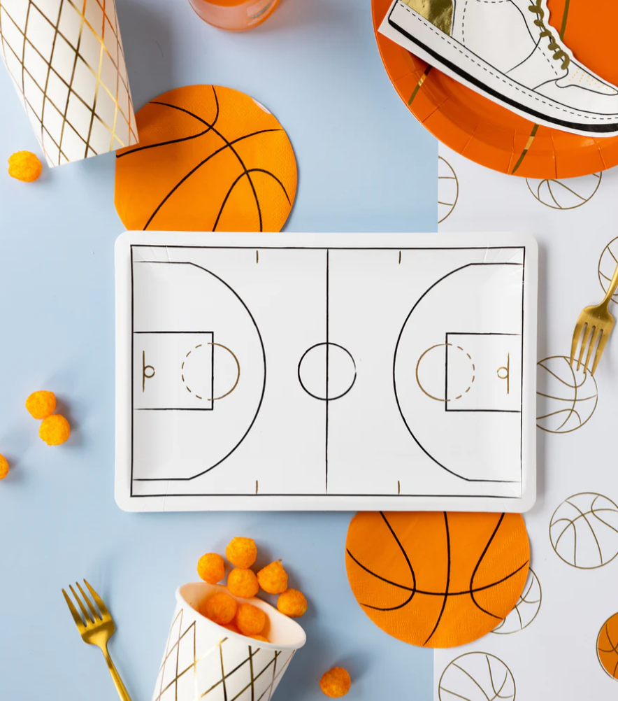 Image of a die-cut basketball napkin on a party table laydown