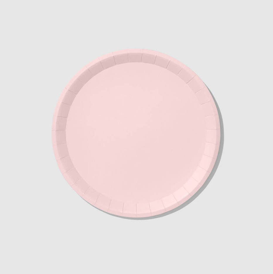Round pink plate on a light gray background
