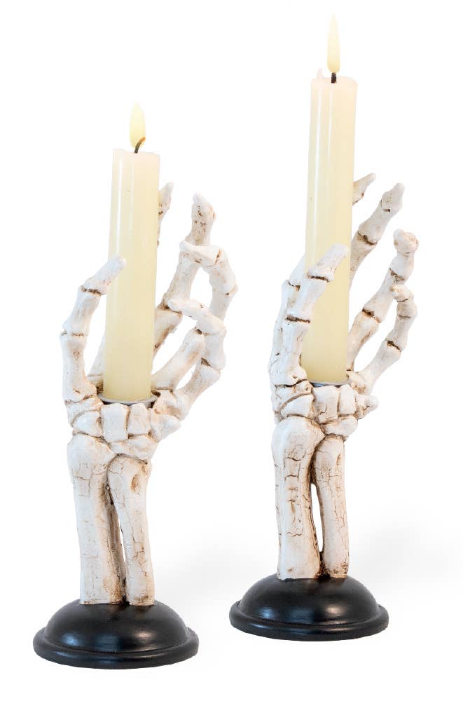 Image of 2 skeleton hand candle holders