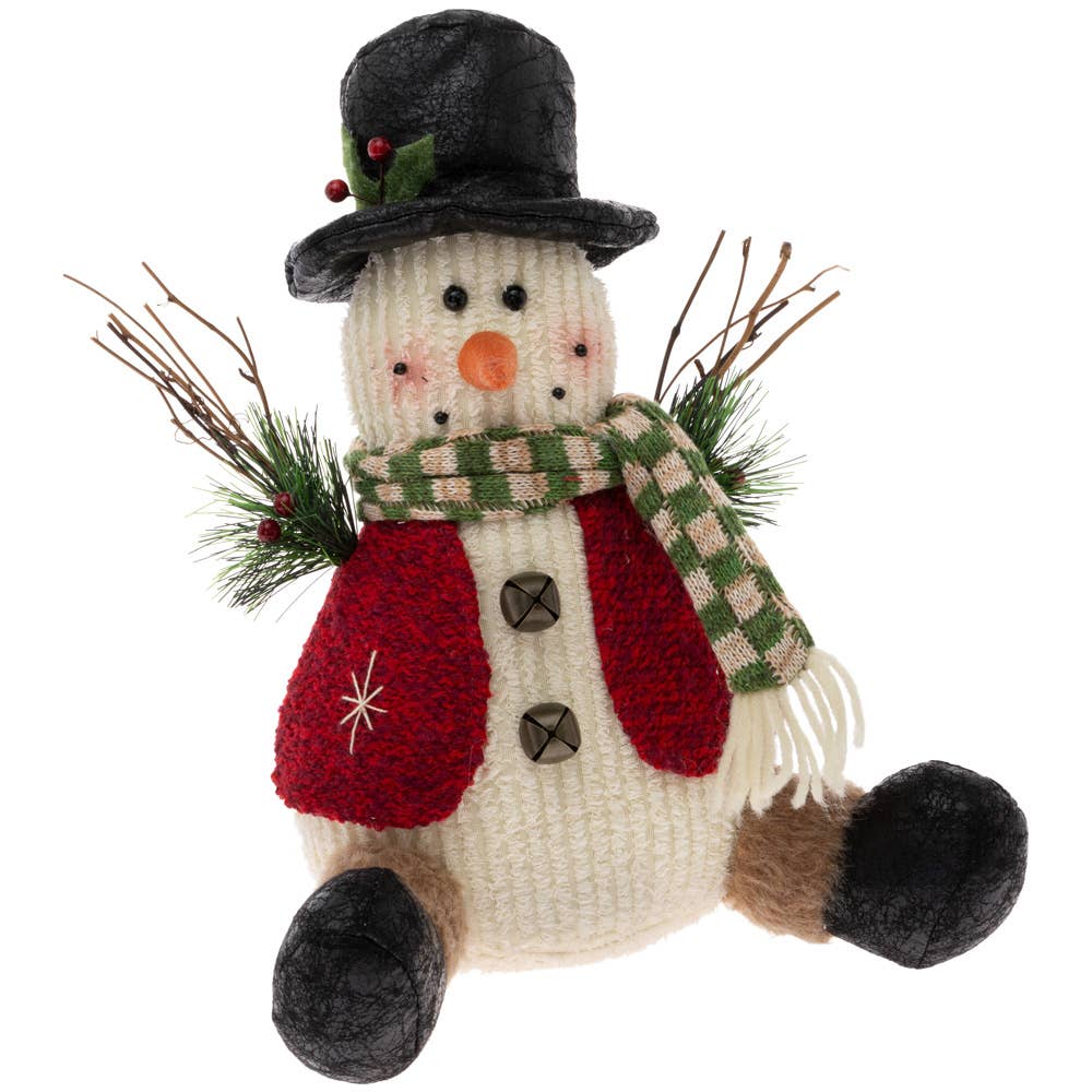 decorative snowman figure with twig arms, a black hat, striped scarf and red sweater