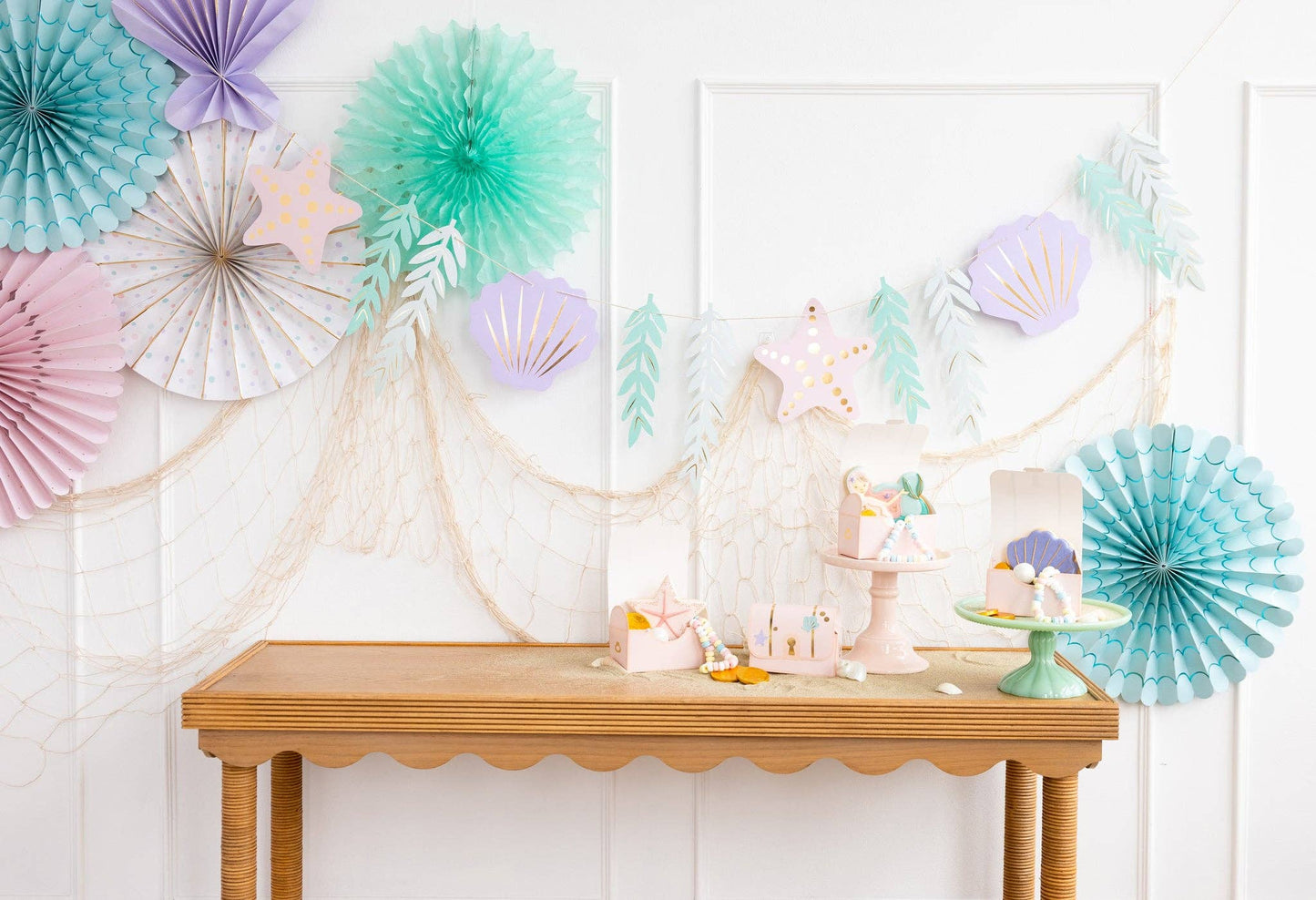 mermaid-themed party banner featuring seashells, starfish and seaweed