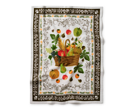 Decorative tea towel with a basket of fruits and vegetables design on a white background