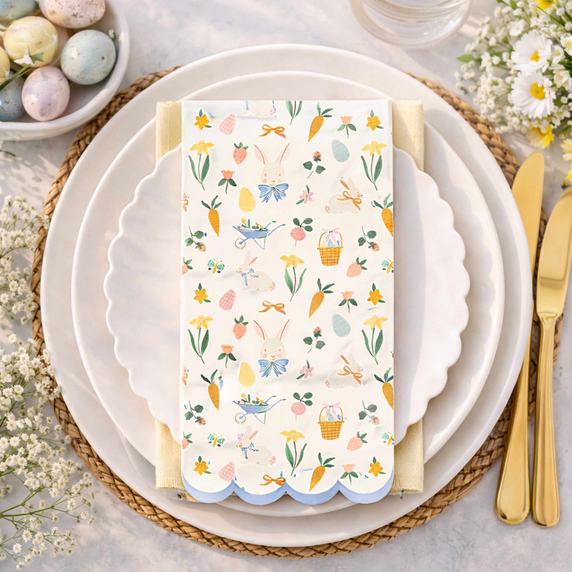 Easter-themed place setting with a decorative napkin on a white plate.