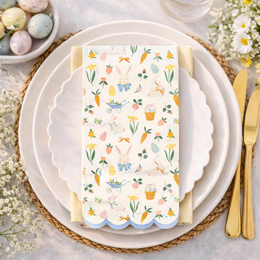 Easter-themed place setting with a decorative napkin on a white plate.