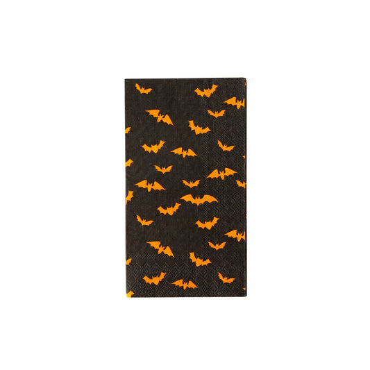 Black dinner napkin with orange bat pattern on a white background