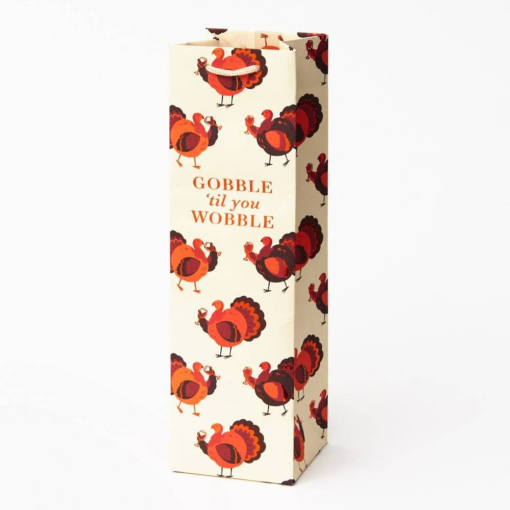 wine bag holder featuring turkey print and "gobble til you wobble" text