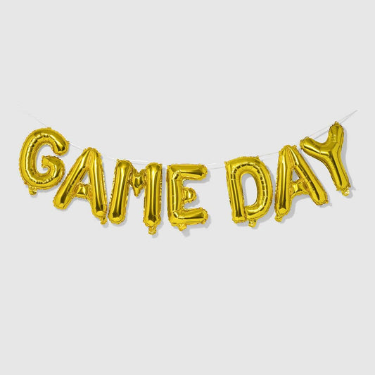 Image of a gold game day balloon banner strung up