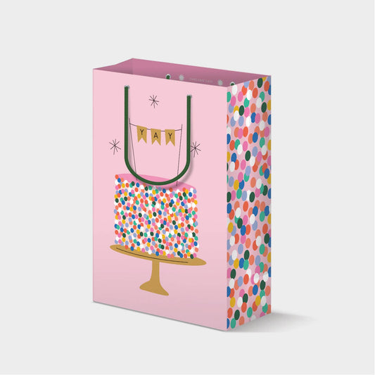 pink gift bag with birthday cake and polka dots