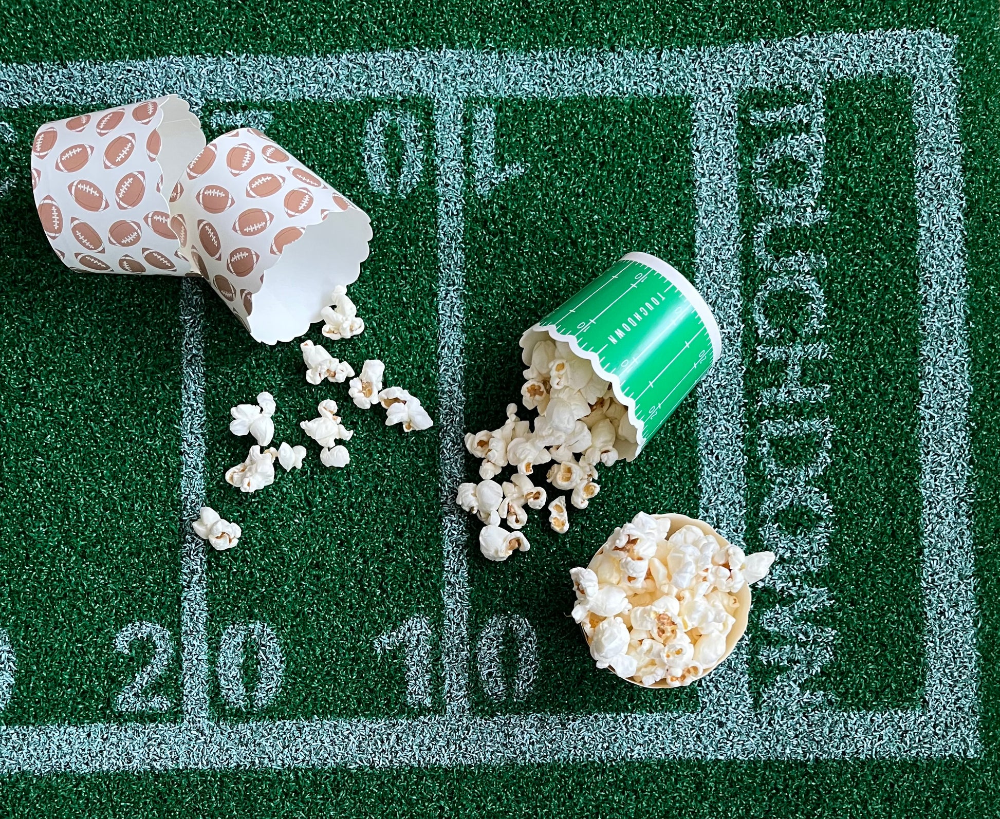 Image of football food cups with popcorn inside