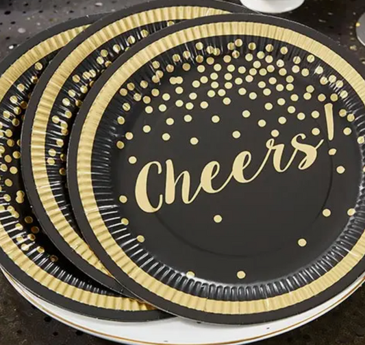 Kate Aspen black paper plates with gold foil accents and the word "Cheers!" across the plate