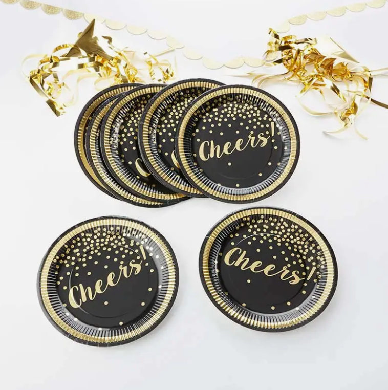 Kate Aspen black paper plates with gold foil accents and the word "Cheers!" across the plate