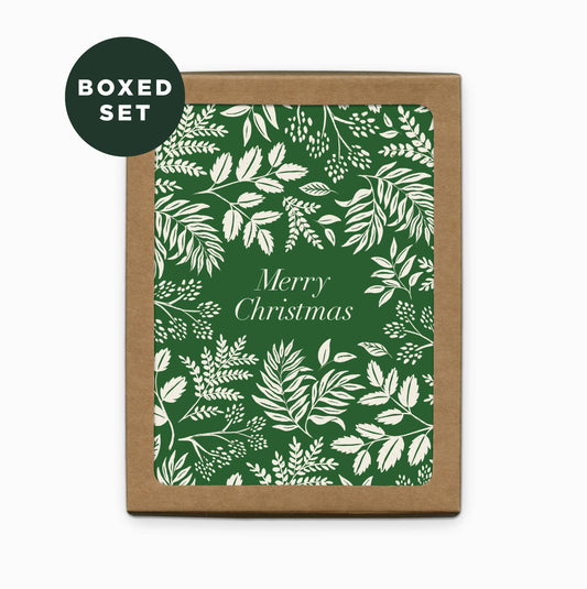 Front image of a boxed set of green and white Christmas cards